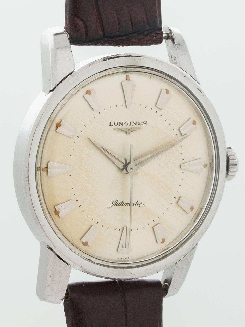 Longines Stainless Steel Automatic ref 9006 circa 1960. 35 x 43mm case with screw down back with embossed VIII Olympic Winter Games California 1960 logo. Smooth bezel and acrylic crystal. Very pleasing minimalist modern style original cream dial