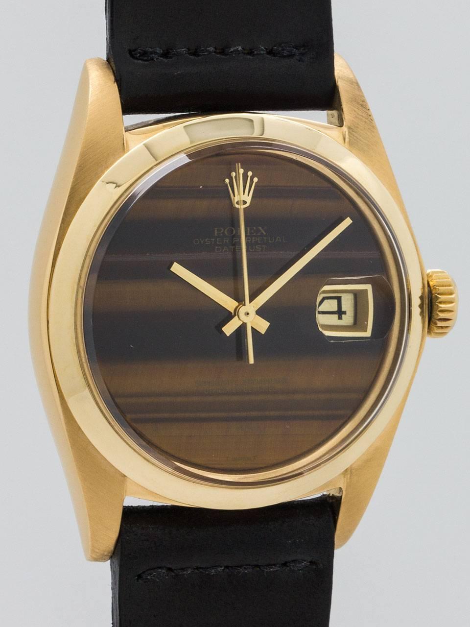 Vintage Rolex 18K Yellow Gold Datejust with factory Tiger’s Eye dial ref 1601  circa 1974. Full size man’s 36mm diameter case with smooth bezel and acrylic crystal. Original factory tiger’s eye stone dial with bold and prominent zoning, free of
