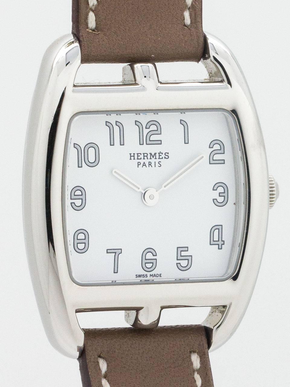Lady Hermes Cape Cod Wristwatch circa 2000s. Featuring 26.5 x 28 mm tonneau shaped case with sapphire crystal and signed crown. White dial with silver arabic figures and straight hands. Battery powered quartz movement. With very good condition,