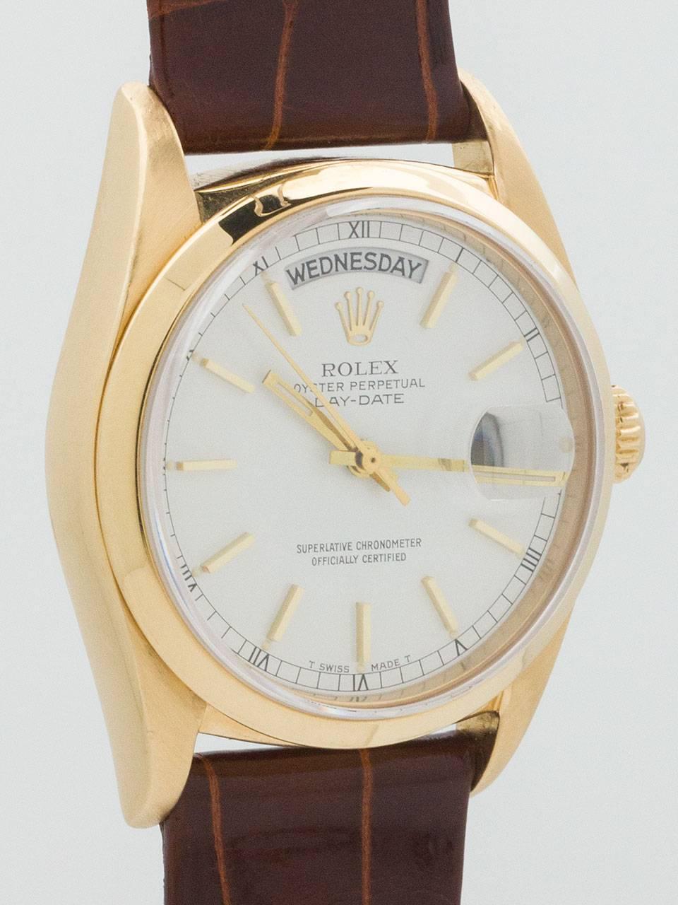 Rolex Yellow Gold Day Date Wristwatch ref 18038 circa 1985. Great looking full size man’s 36mm case with smooth bezel and sapphire crystal. Unusual original white enamel dial with applied gold indexes and gold baton hands. Powered by self winding