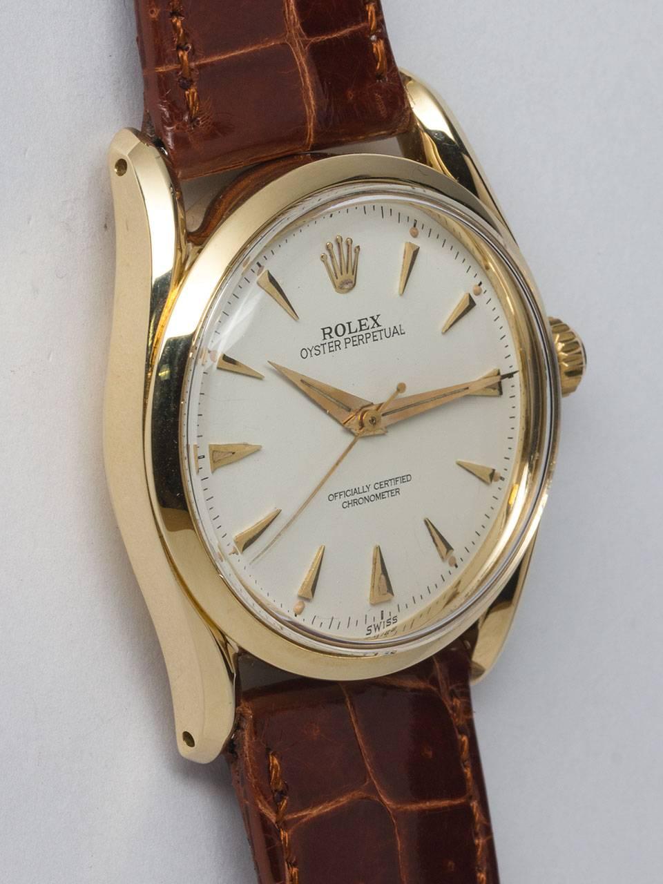 Rolex 14K Yellow Gold Bombe ref 6292 serial number 948,xxx circa 1953. 34 x 40mm bombe style case with bowed lugs, smooth bezel and acrylic crystal. Beautifully restored antique white dial with gold applied tapered indexes and hands. Powered by