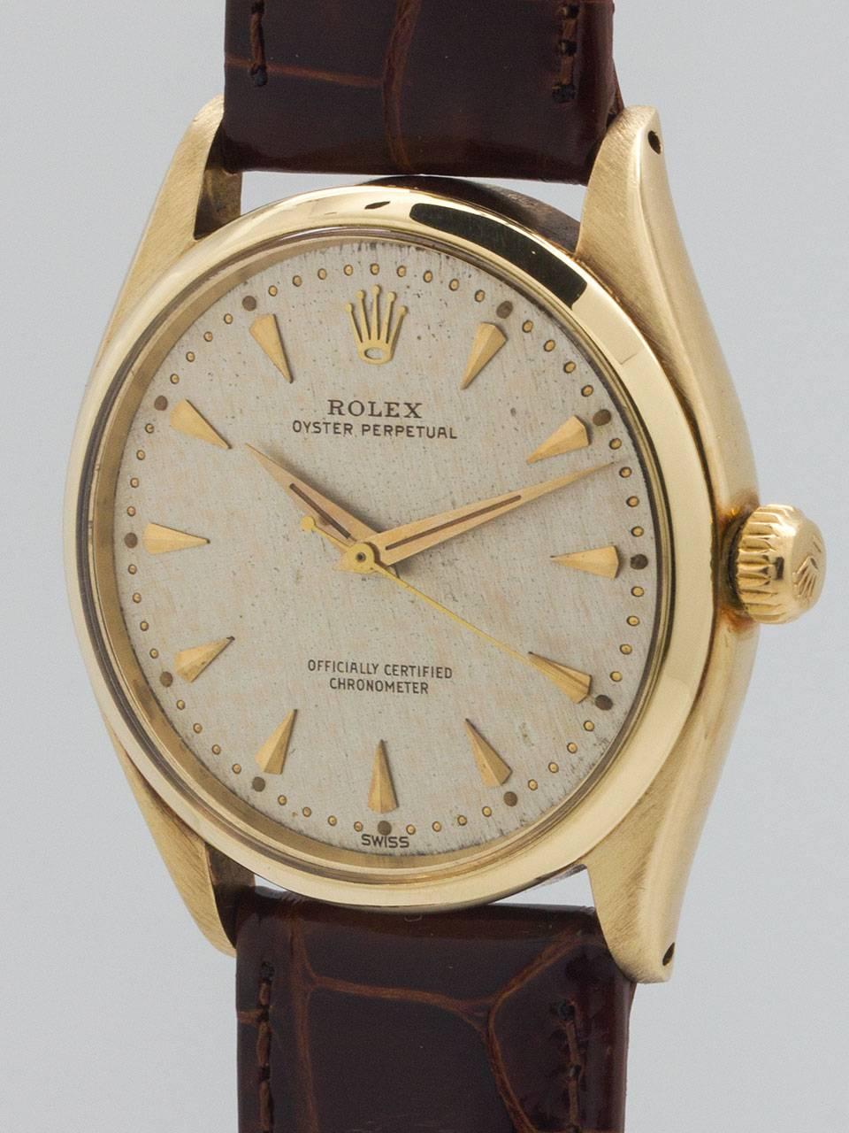 Rolex 14K Yellow Gold Oyster Perpetual Wristwatch ref 6564 serial number 435,xxx circa 1960. Featuring 34mm diameter Oyster case with smooth bezel, acrylic crystal, screw down crown and case back. Featuring an unusual, original matte silvered finely
