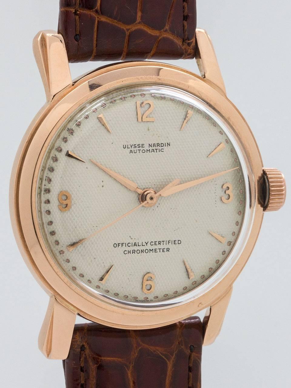 Vintage Ulysee Nardin 18K Rose Gold Automatic Dress model circa 1950s. Featuring a robust design 34 X 42mm case with heavy and sloped lugs. original antique white waffle dial with applied rose gold indexes and rose gold tapered alpha style hands.