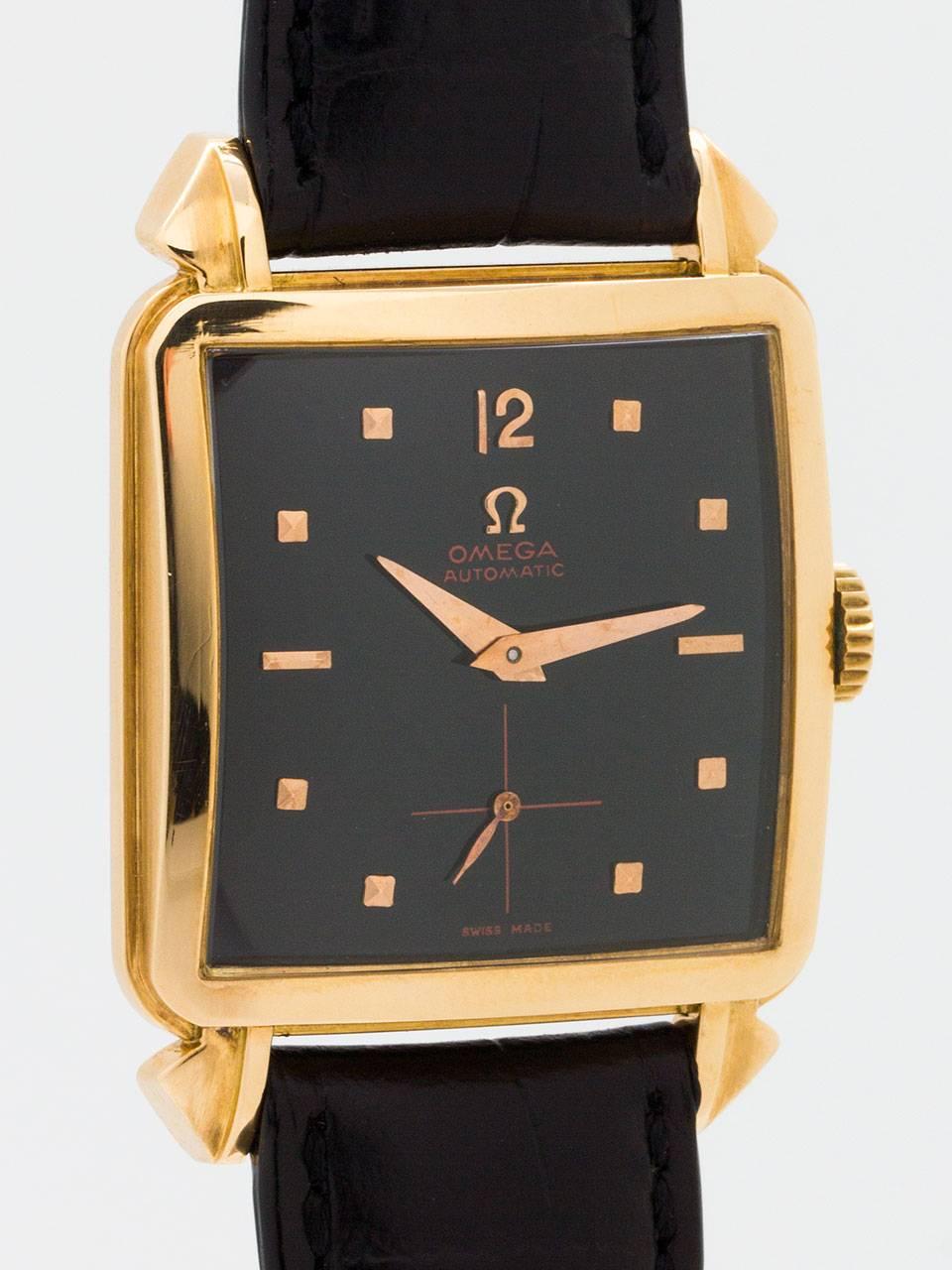 Great looking oversize Omega 14K Rose Gold square case automatic circa 1950’s with large extended lobed lugs. Featuring very large for the era 33 X 42mm case with glass crystal and stylized lugs. Professionally restored glossy black dial with
