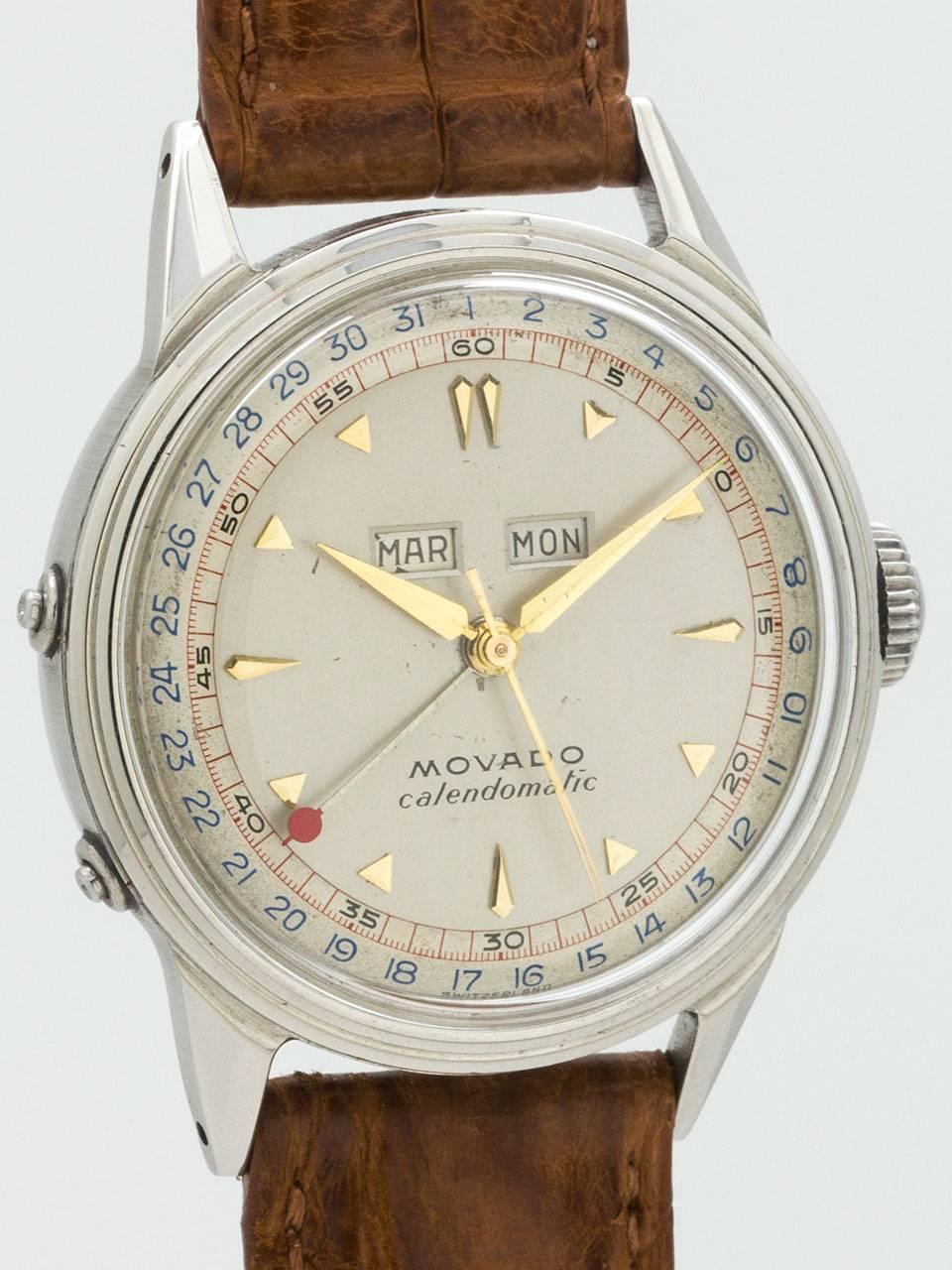 Great looking vintage Movado Calendomatic circa 1950s. Featuring 35mm diameter stepped case with screw down case back and acrylic crystal. Very pleasing 2 tone original silvered satin dial with gold applied triangular indexes and tapered gilt hands.
