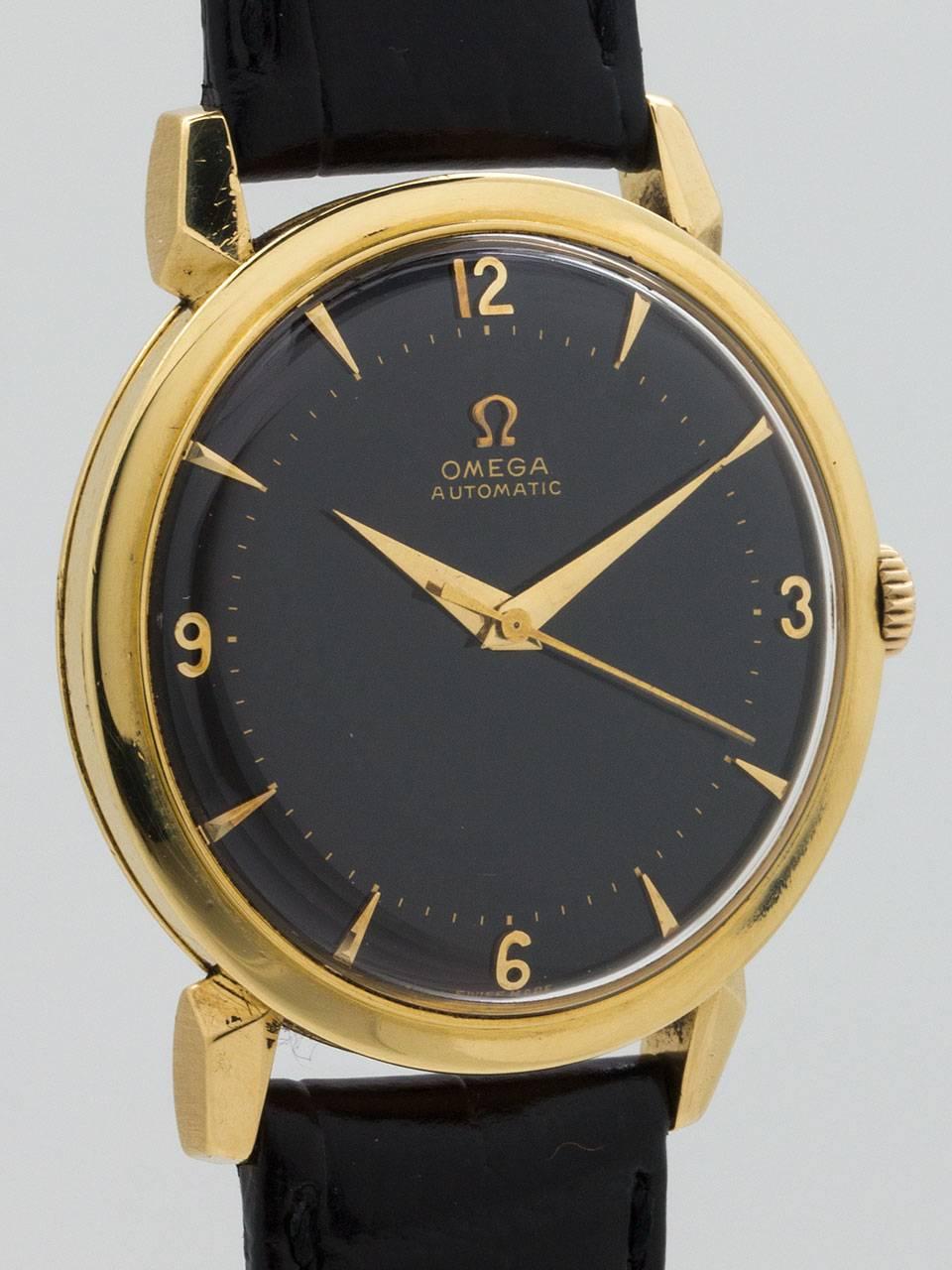 Omega 18K Yellow Gold Dress Wristwatch ref 2710 SC circa 1950’s. Featuring 35 X 42mm case with extended horn lugs and acrylic crystal. Beautiful condition black original dial with gold applied indexes, applied Omega logo, and tapered gilt hands.