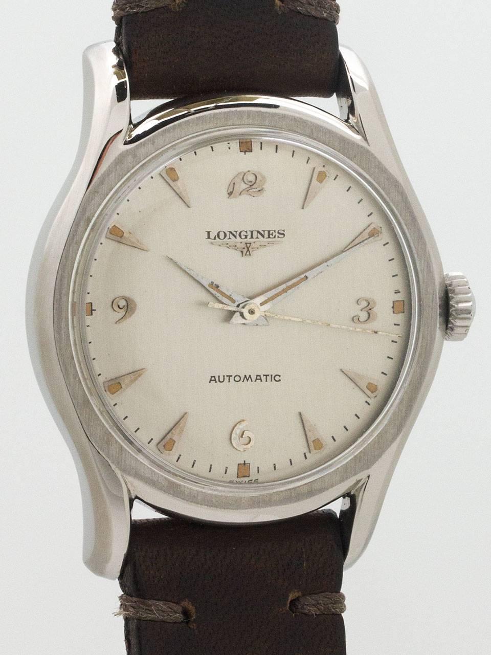 Vintage Longines Stainless Steel Automatic Wristwatch circa 1958. Featuring 34 X 42mm diameter case with curved and extended bombay style lugs. Very nice looking professionally restored matte silver dial with applied silver breguet and tapered