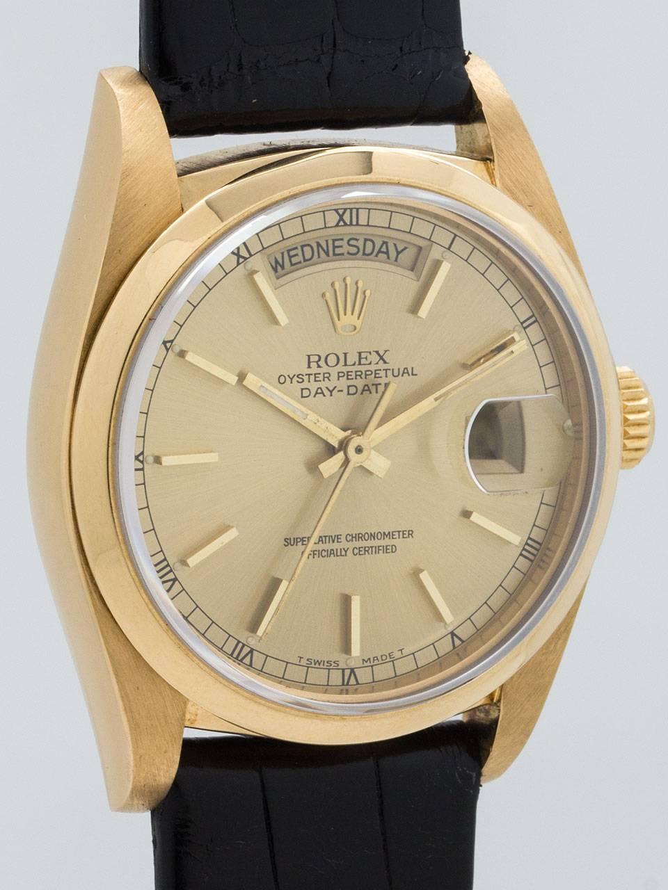 Rolex 18K Yellow Gold Day Date ref 1803 serial no. 5.7 million circa 1978/79. Super sharp condition 36mm diameter full size man’s model with smooth bezel and sapphire crystal. Very pleasing original champagne pie pan dial with applied gold indexes,
