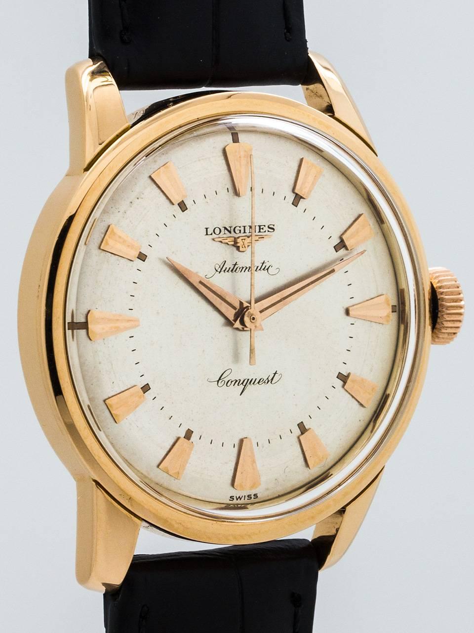 Classic vintage Longines 18K Rose Gold Conquest circa 1960’s. Featuring a 35 X 42mm screw back case with wide bezel and screw down case back with enameled embossed. Conquest logo, signed rose gold water proof style crown and acrylic crystal. Very