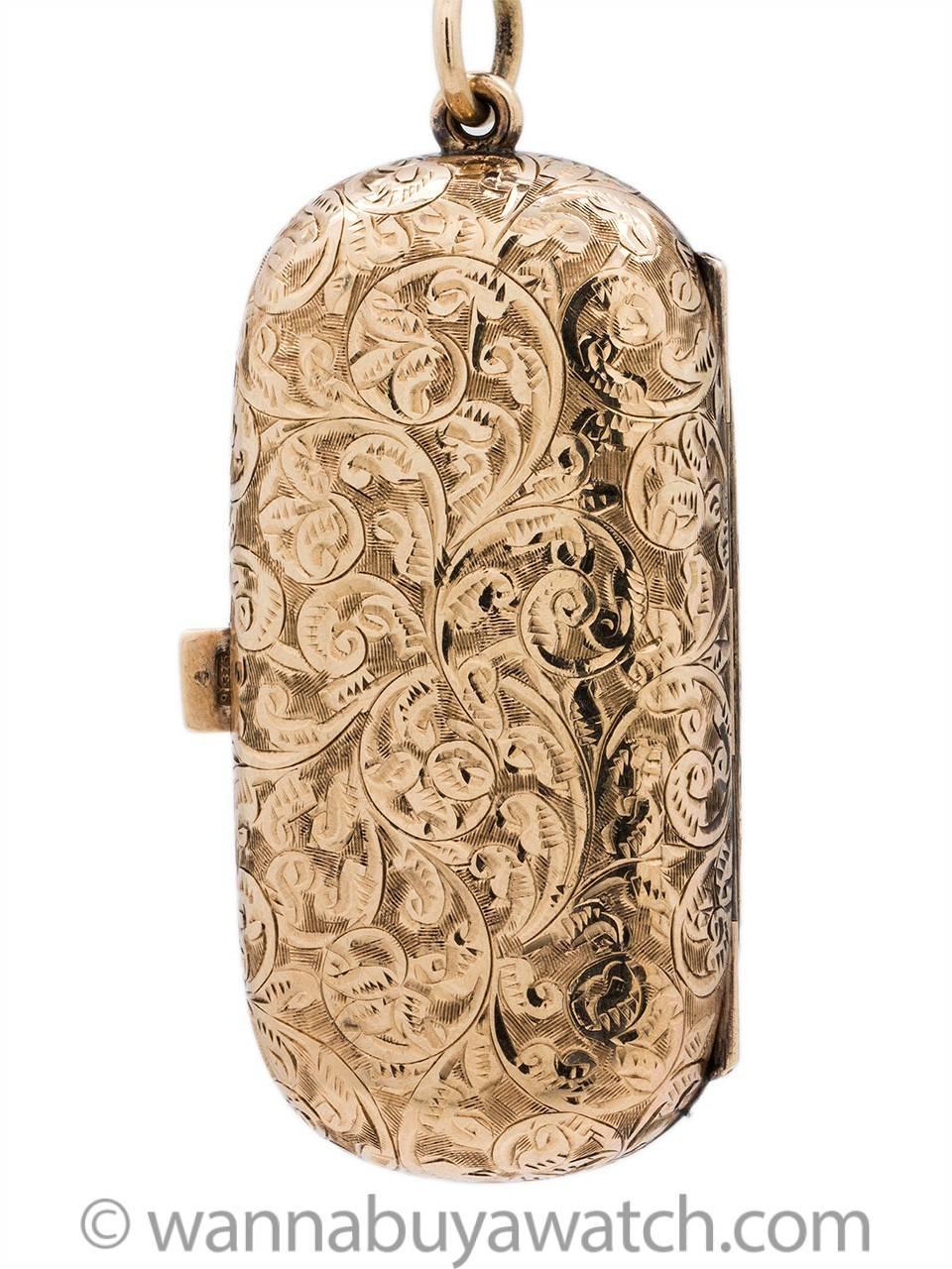 A beautifully executed 9K gold hand chased coin purse likely intended for carrying gold British Sovereigns circa 1910. Lozenge shaped case 1.12 in from side to side, 2.24 inch from top to bottom with hinged back which springs open when lever is