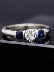Kwiat Sapphire Diamond Platinum Three-Stone Ring, circa 2000s