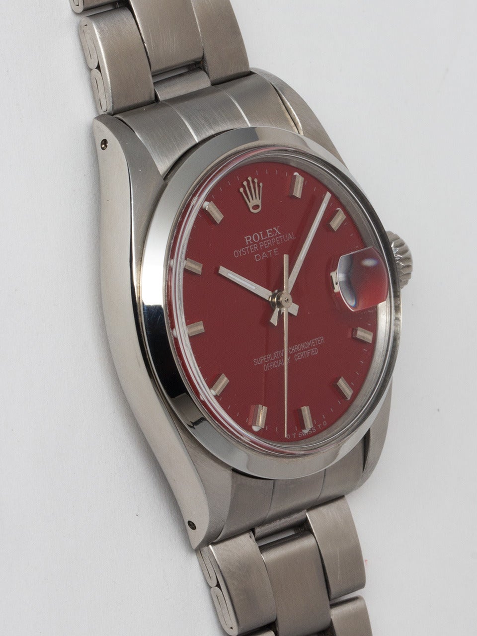 Rolex Stainless Steel Oyster Perpetual Date Wristwatch ref 1500 serial #2.7 million circa 1971. 34mm diameter case with smooth bezel and acrylic crystal. Gorgeous custom colored Vampire Red dial with applied silver indexes and silver baton hands.