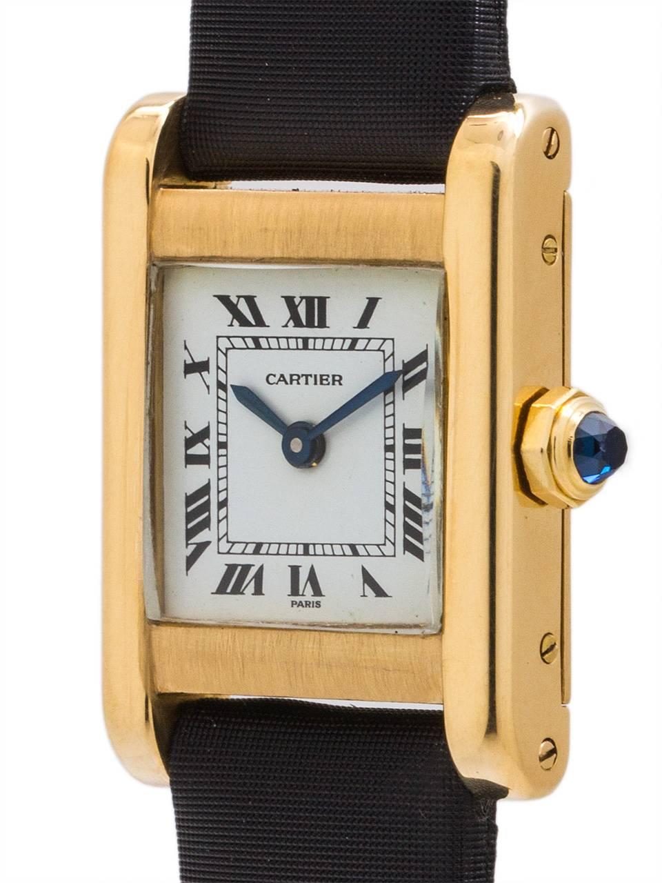 
Cartier Lady’s 18K Gold Tank “Normale” circa 1970’s. Featuring 22 X 30mm rectangular case secured by 4 case screws. Featuring classic white enamel dial with printed black Roman numerals and blued steel hands and signed SWISS. Powered by 17 jewel