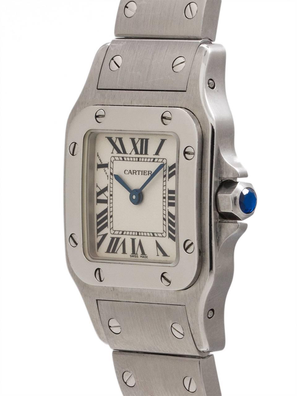 
Lady Cartier Santos Galbe stainless steel with classic white dial with black Roman figures circa 2000’s. Featuring a 24 x 35mm diameter contoured back case with steel bezel secured by 8 screws. Featuring a sapphire crystal, classic white dial and