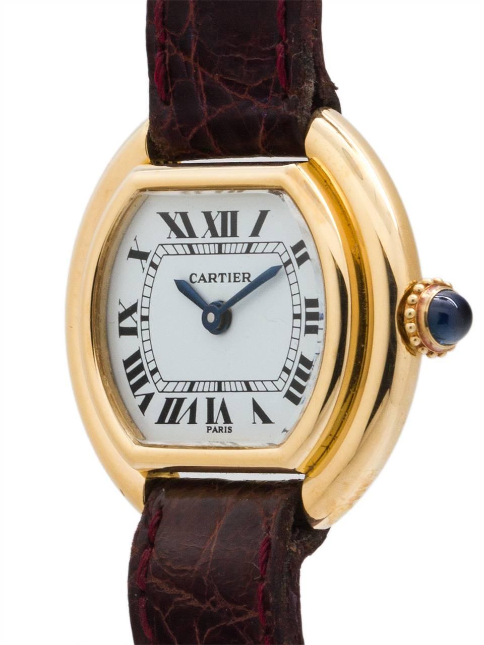 
Cartier 18K YG lady Vendome model, 24mm x 26mm, circa 1970’s. Scarce and great looking tonneau shaped case with stepped and grooved sides. With mineral glass crystal and classic original white Cartier dial with Roman figures and blued steel hands.