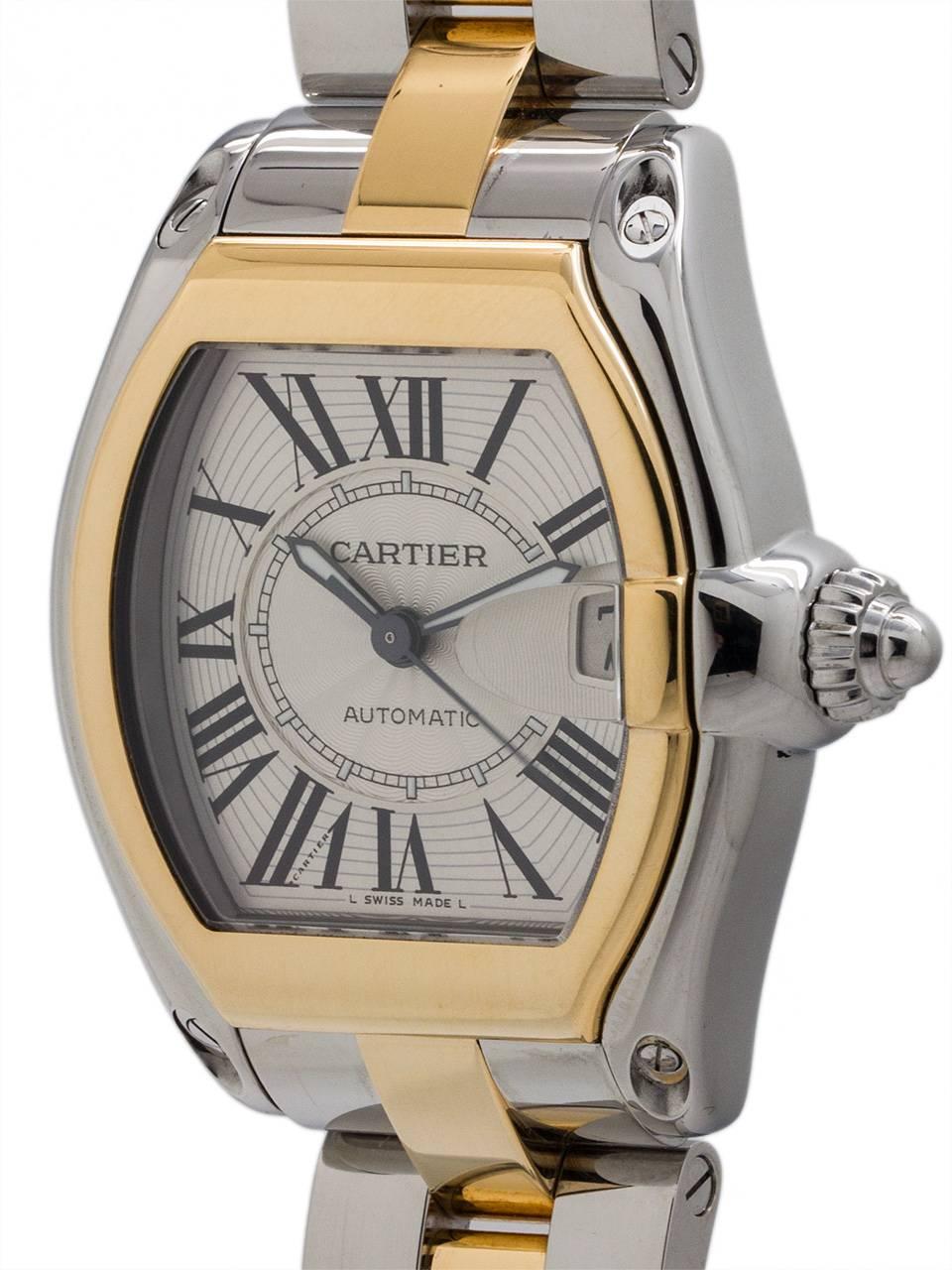 
Cartier Man’s Roadster automatic model ref# W62026Y4 circa 2000s. Featuring 38 x 44.5mm tonneau shaped stainless steel and 18K YG case with steel cabochon style screw down crown, matte silver textured dial with black stretch Roman numerals, and