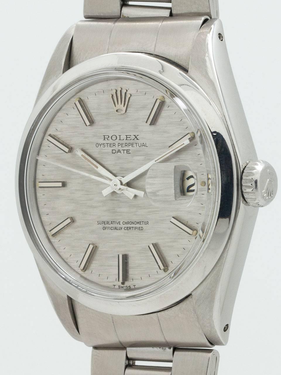 
Rolex Oyster Perpetual Date ref 1500 circa 1970. Featuring 34mm diameter case with smooth bezel, acrylic crystal, and original anthracite gray “linen” texture dial with applied silver indexes and silver baton hands. Powered by caliber 1570 self