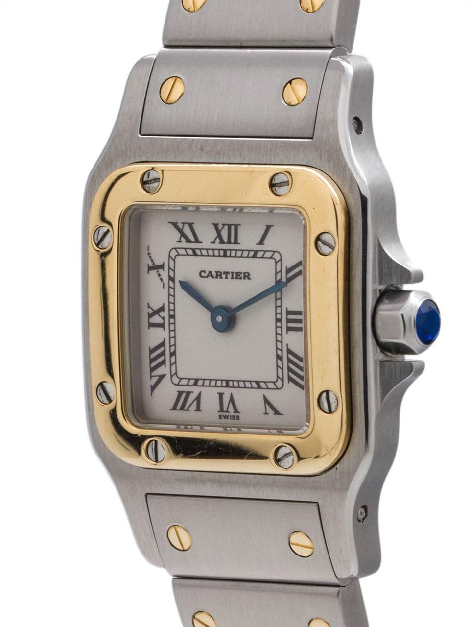 
Lady Cartier Santos Galbe stainless steel and 18K YG with classic white dial with black Roman figures circa 2000’s. Featuring a 24 x 35mm diameter contoured back case with 18K YG bezel secured by 8 gold screws. Featuring a sapphire crystal, classic