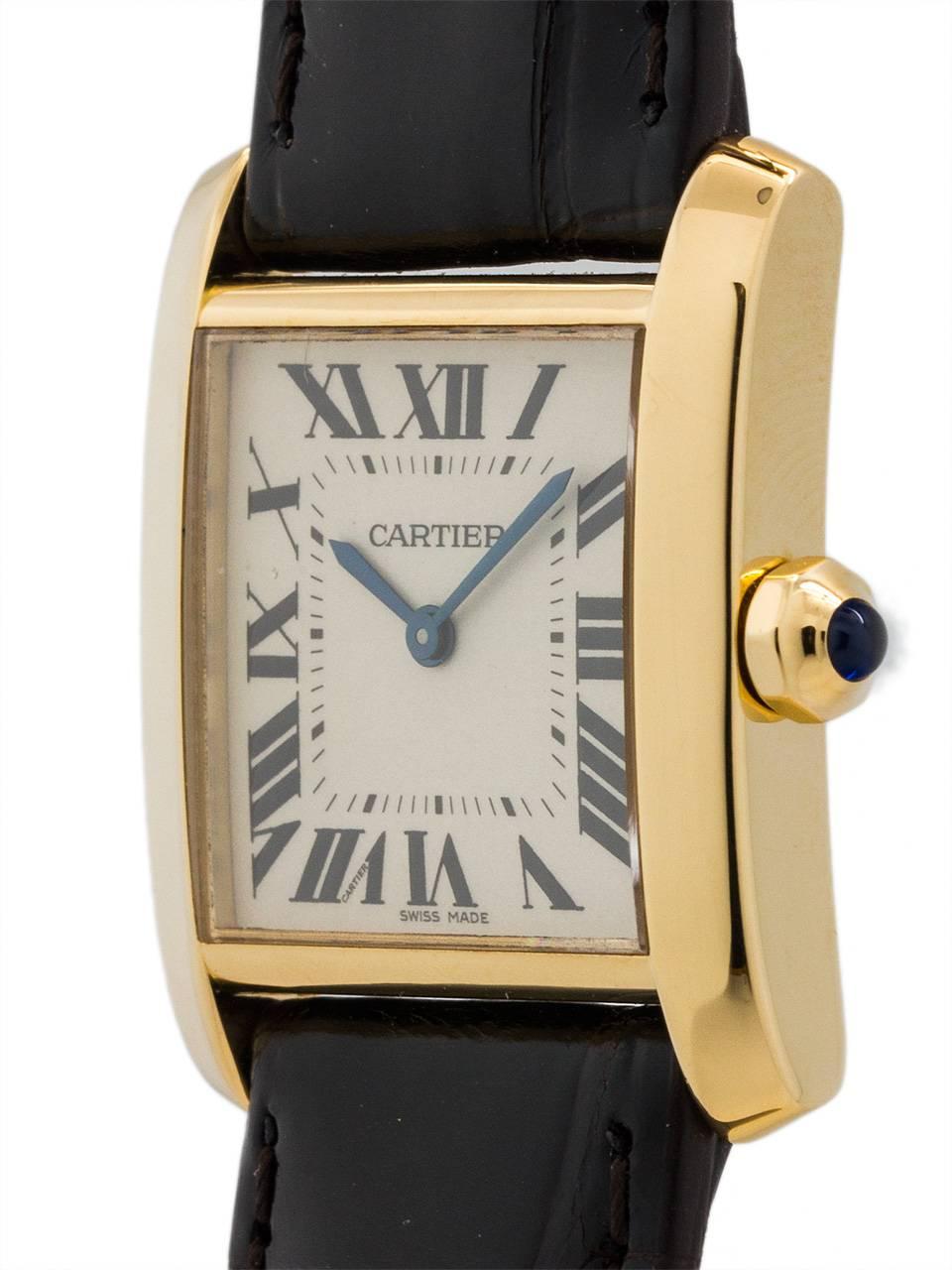 
Cartier 18K YG midsize Tank Francaise 26 X 35 mm classic model on strap with 18K Cartier tang buckle. Featuring classic silvered guilloche dial with  black printed Roman numerals and blued steel hands and sapphire cabachon crown. Battery powered