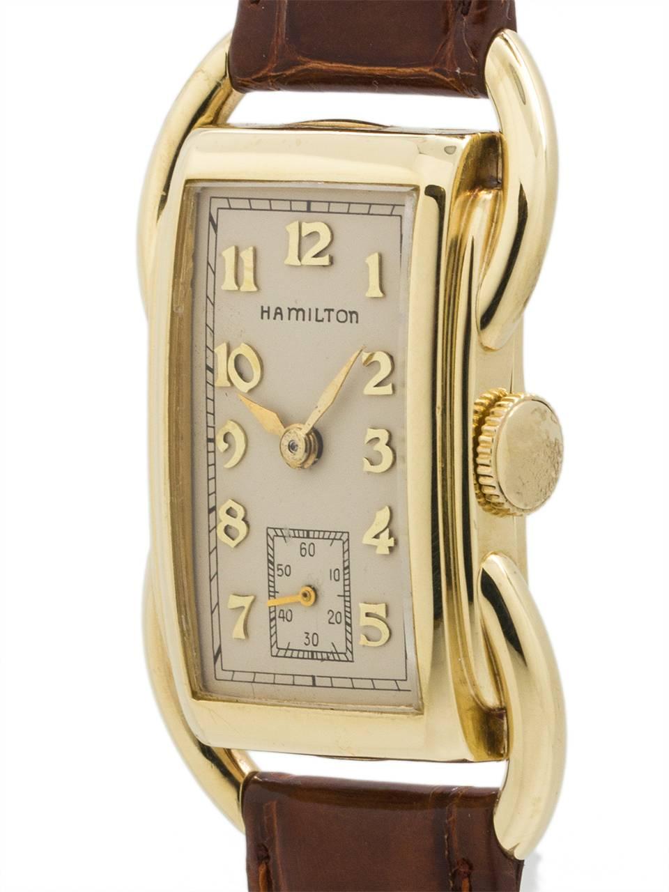 
Vintage man's Hamilton 14K YG “Bentley” model with personalized case back engraving dating this example to 1939. The Bentley is one of the most distinctive case designs of the early Hamilton models with prominent curved tubes on each side of the