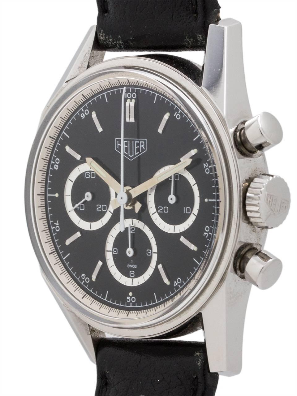 
Heuer circa 1990’s reissue of the classic 1964 Carrera 3 registers manual wind in minty condition with used original perforated racing strap and Heuer buckle. Model ref # CS3111.BC0726. Featuring a 36 X 38 mm case with screw down case back, round