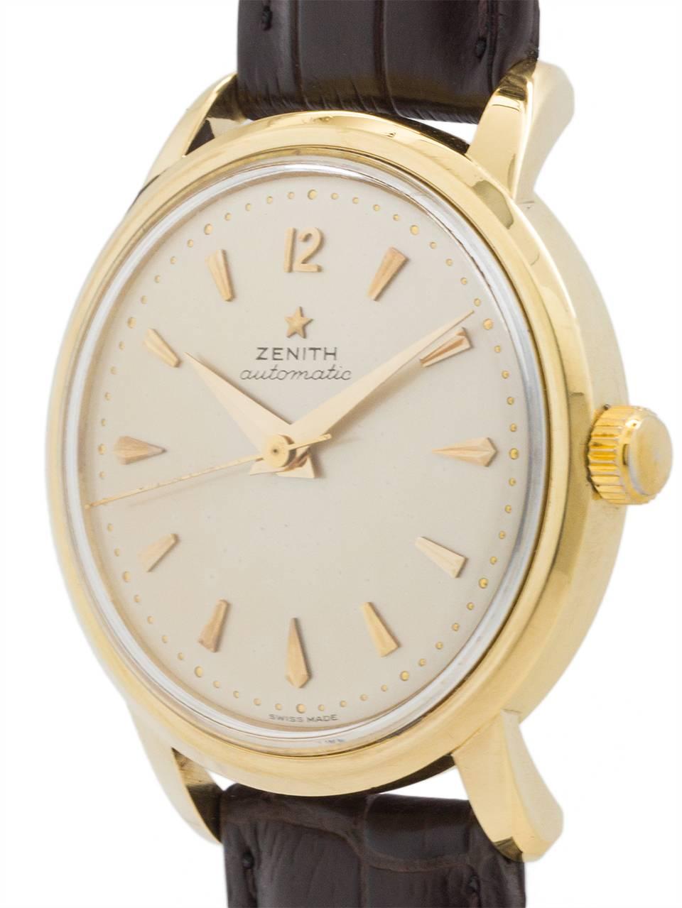 
Scarce and very collectible Zenith 18K gold automatic dress model powered by with highly regarded calibre 133.8 chronometer movement circa 1958. This is a beefy 35 x 41mm heavy gold case,with a beautiful condition original matte silvered dial with