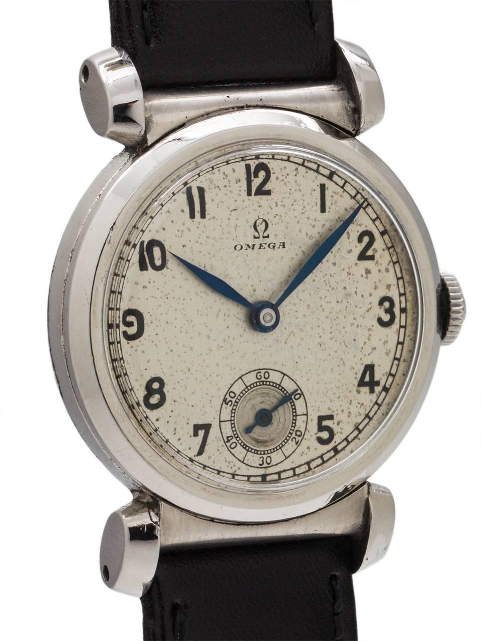 
Vintage Omega military style manual wind model movement serial# 9 million circa 1926. Featuring a 32mm diameter stainless steel case with wonderful hooded lugs on either side of a fixed end link. With original silver dial, now patina’d with a warm