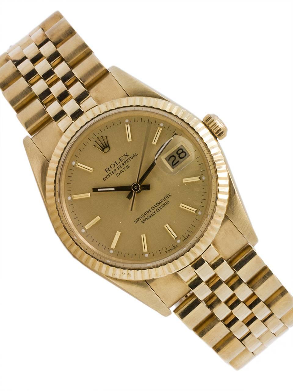 
Rolex Oyster Perpetual Date ref 15037 serial # 9.8 million circa 1986. Featuring 34mm diameter case with fluted bezel, acrylic crystal, and original champagne dial with applied gold indexes and gilt baton hands. Powered by caliber 3035 self winding