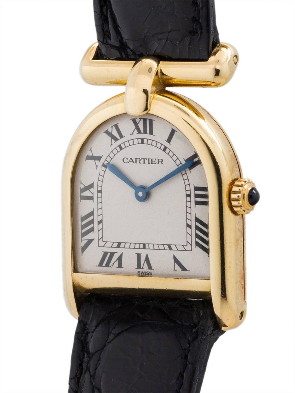 Cartier 18K YG Lady “Cloche” circa 1990’s. Featuring unusual bell shaped (cloche) case secured by 4 gold case screws, classic white dial with black printed Roman figures, with blued steel hands, cabochon sapphire crystal, and battery powered quartz