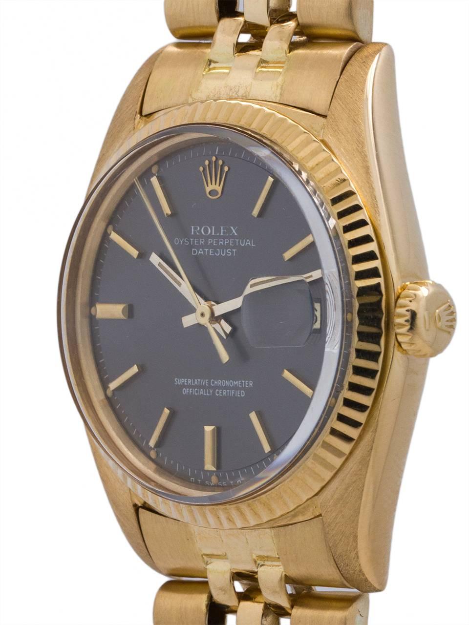 
Rolex 18K Yellow Gold Datejust ref 1601 circa 1974. 36mm diameter full size man’s model with fluted bezel and acrylic crystal. Featuring a scarce and striking original dark grey pie pan dial with applied yellow gold indexes and baton hands. Powered