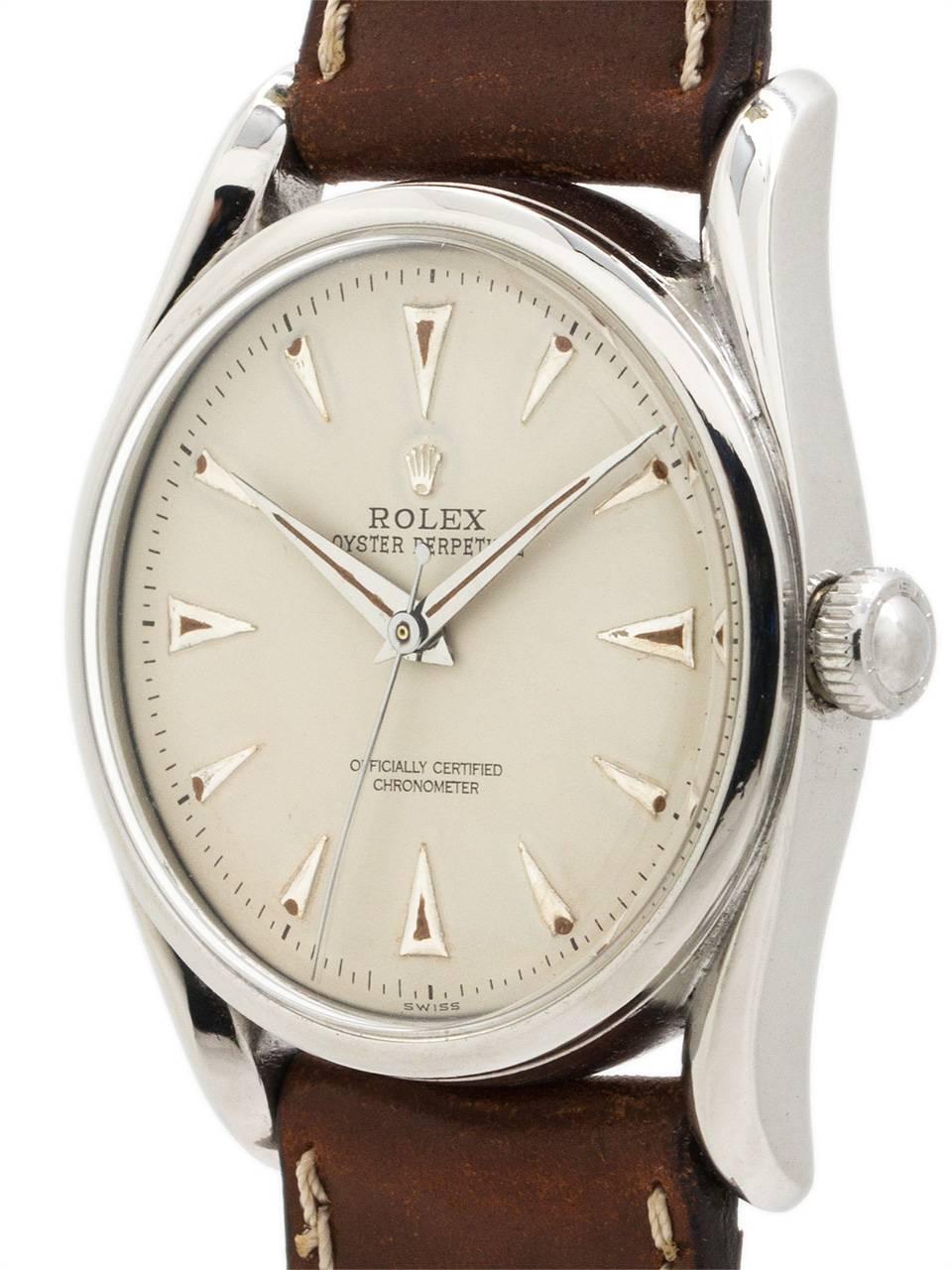 Scarce and desirable model Rolex  stainless steel “Bombe ref 5018 serial # 608,xxx circa 1948. Featuring 35mm diameter Oyster case with extended bowed lugs, smooth bezel, acrylic crystal, and very pleasing refinished antique white dial with raised