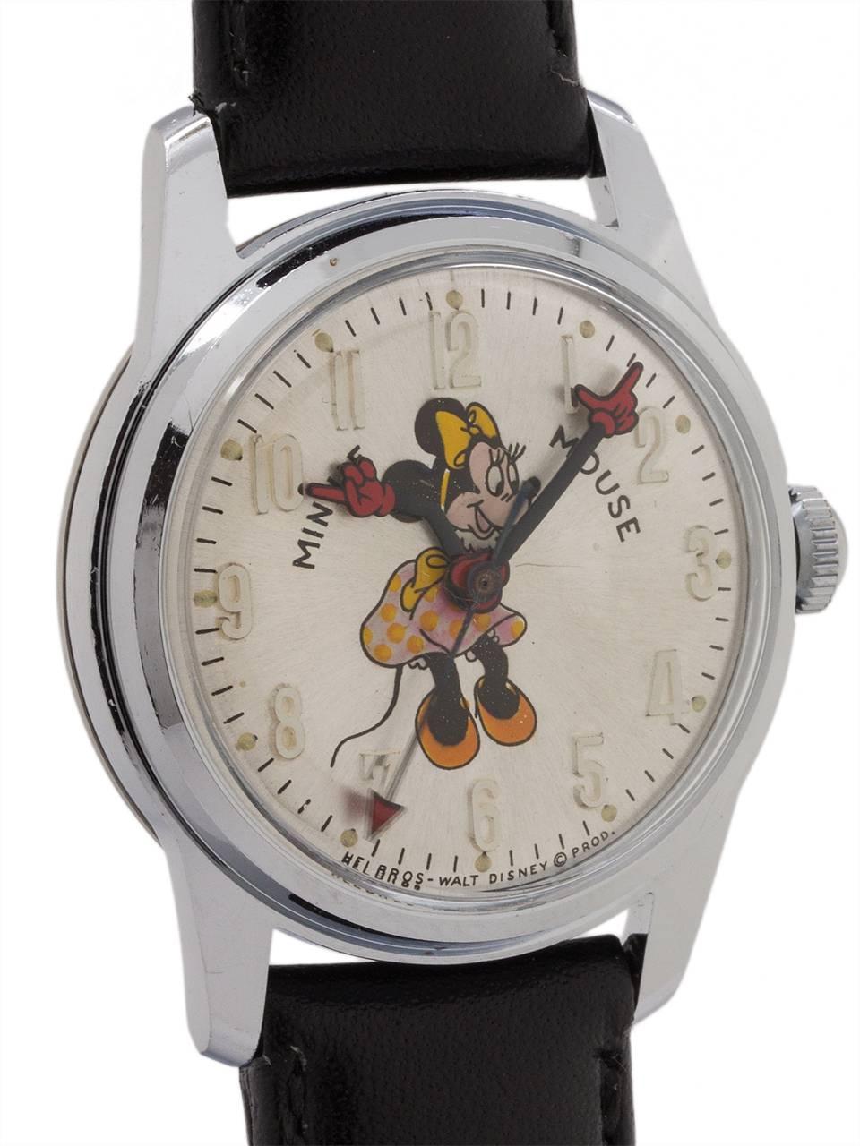 
Vintage medium size Helbros 17 jewel manual wind Minnie Mouse watch circa 1970’s. Featuring 31mm diameter chromium plated case with steel screw down back, with acrylic crystal, and with excellent condition original dial with polychrome depiction of