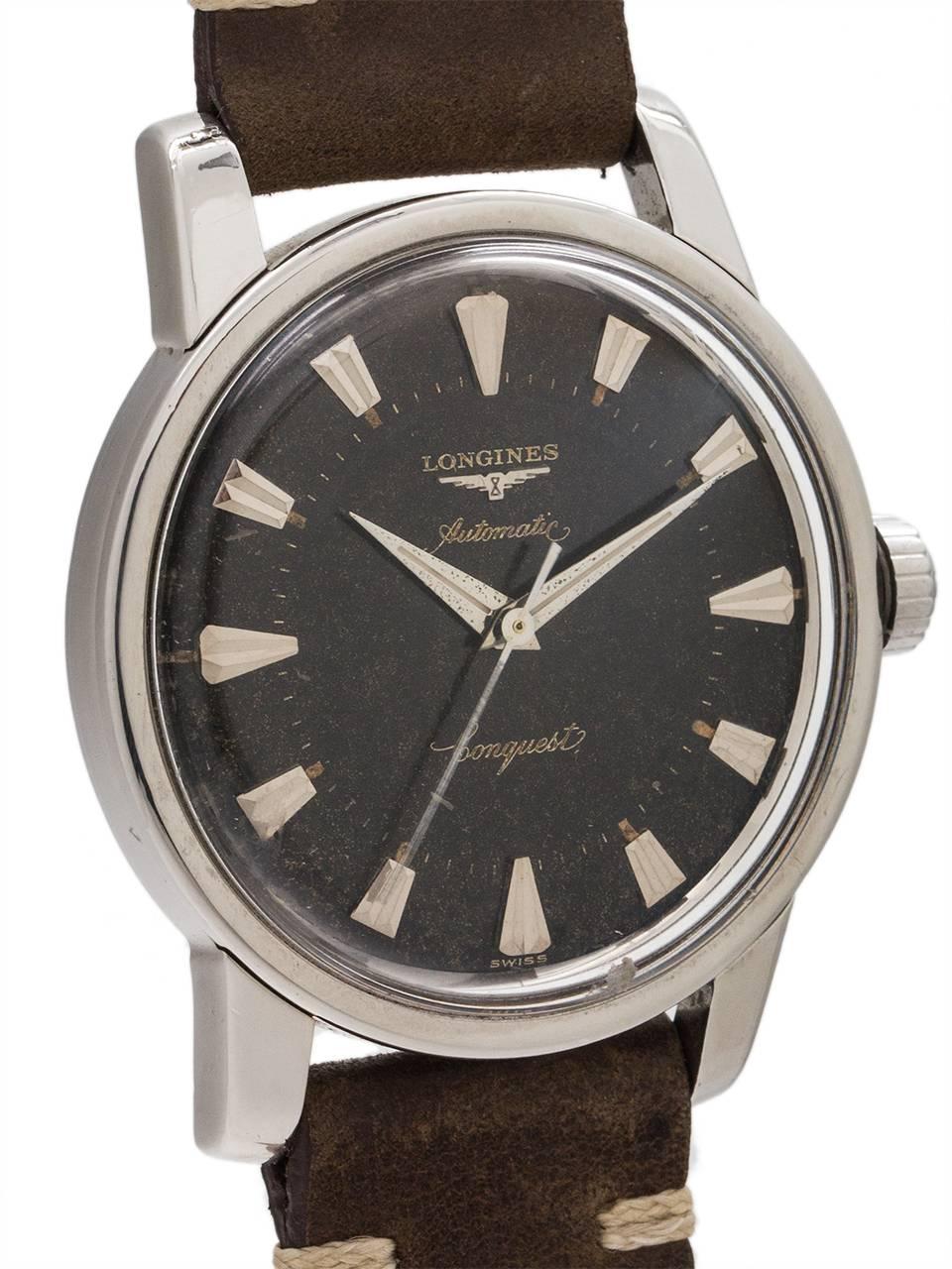 
Longines Conquest stainless steel automatic circa 1960. Featuring a robust 36mm diameter case with wide bezel and heavy rounded lugs, and screw down caseback with fish logo. Acrylic crystal, and original black “tropical” dial with applied oversize