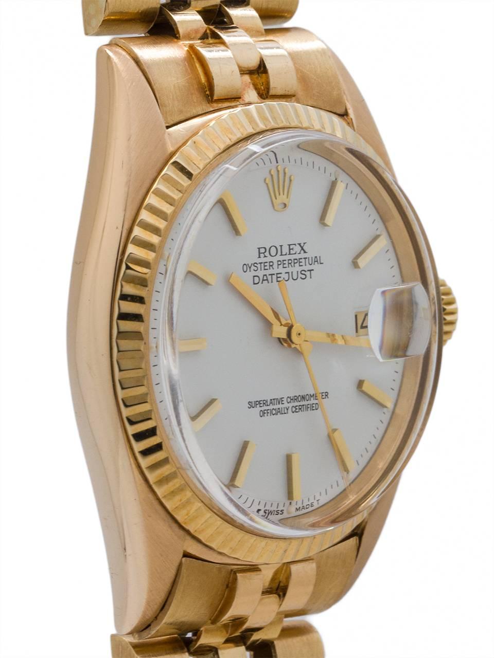 
Rolex 18K gold Datejust ref# 1601 serial number 2.5 million circa 1970. Featuring a 36mm diameter Oyster case with fluted bezel, acrylic crystal and signed crown. With lovely, original white enamel dial with applied gold indexes and gilt baton