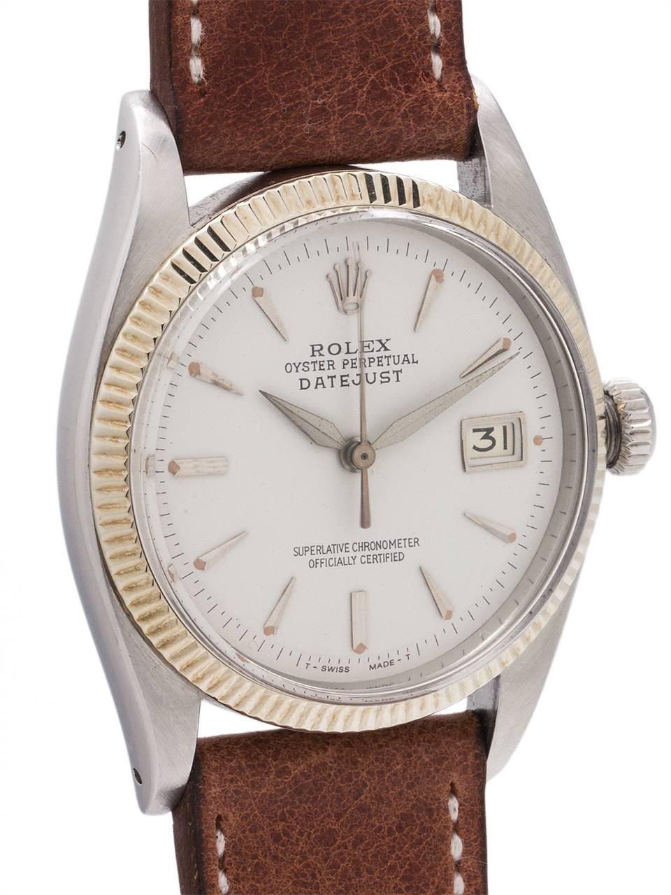 
An early, and exceptional condition Rolex Datejust model ref 6605 serial # 457,xxx circa 1959. Featuring 36mm diameter case with 14K white gold fine milled bezel, acrylic crystal without magnifying cyclops, a refinished antique white dial with