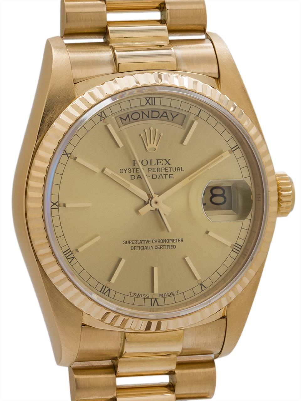 
Rolex 18K YG Day Date President ref# 18038 case serial# 7.4 million circa 1982. Featuring 36mm diameter full size man’s model with sapphire crystal and fluted bezel, with a beautiful original champagne Rolex dial with gold applied indexes and gilt