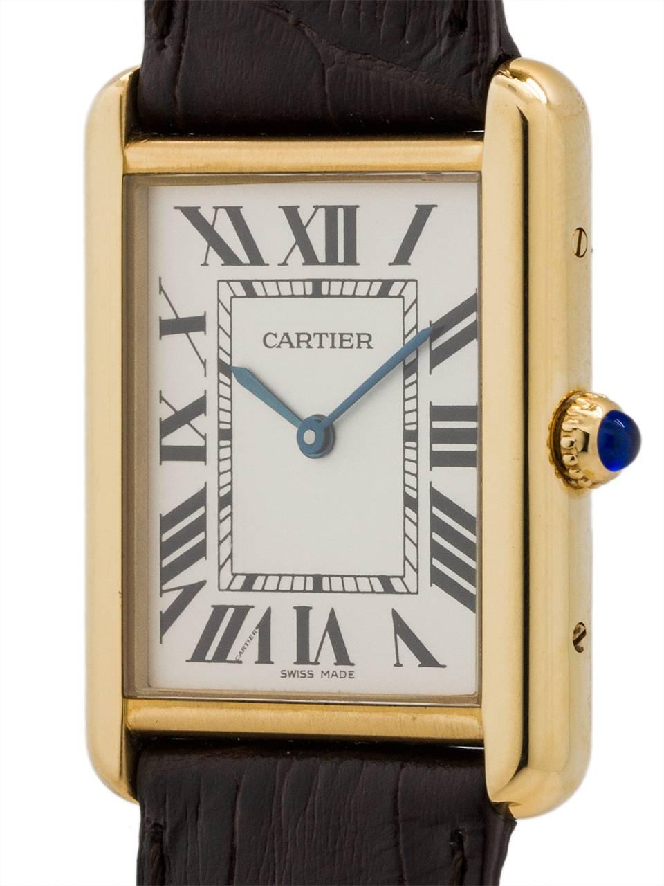 
Man’s Cartier Tank Solo ref# 2472 with 18K YG solid gold top and stainless steel back secured by 4 side and 4 case back screws. Featuring 27 X 34mm case with scratch resistant sapphire crystal, cabochon sapphire crown, and silver opaline dial with