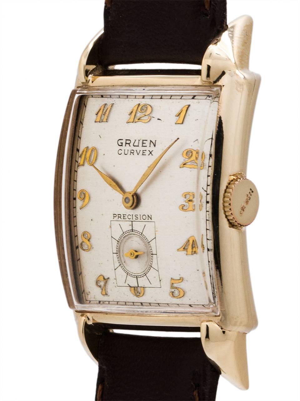 Gruen Curvex 14K YG circa 1940’s featuring 24 X 41mm elongated case with sloping lugs and curved low dome crystal. With pleasing condition original satin dial with raised gold indexes and gilt leaf style hands. Powered by 17 jewel manual wind