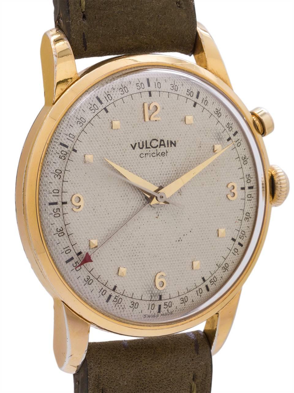 
Scarce oversized Vulcain Cricket manual wind alarm circa 1950’s. Featuring a massive 38 X 46mm case with prominent lugs and heavy snap on back with slots for transmitting sound of alarm. Very pleasing original textured waffle silver dial with