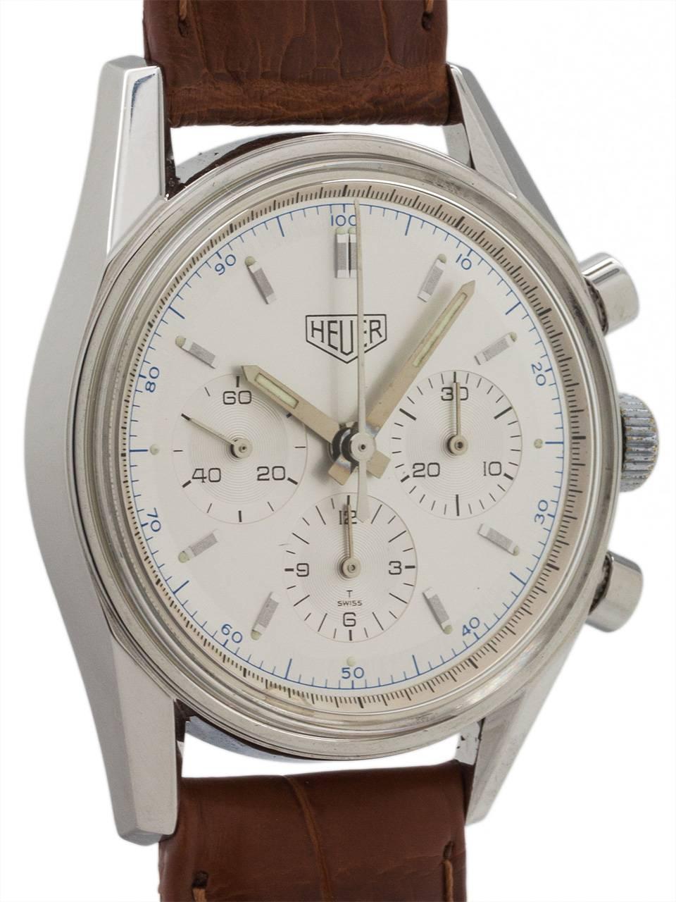 
Heuer circa 1990’s reissue of the classic 1964 Carrera 3 registers manual wind chronograph in excellent preowned condition. Model ref # CS3110, featuring 34 X 38mm case with screw down case back, and round pushers, true to the 1964 original with