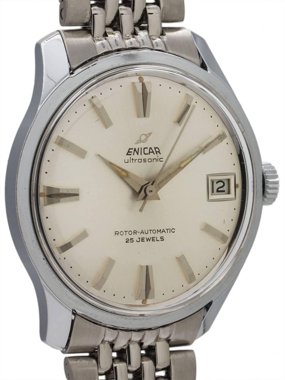 
Enicar stainless steel “ultrasonic” self winding ref 125/001 mid century design dress model circa 1960’s. Featuring mint condition 34 X 40mm case with contoured lugs with screw down caseback with engraved Enicar logo, acrylic crystal, mint
