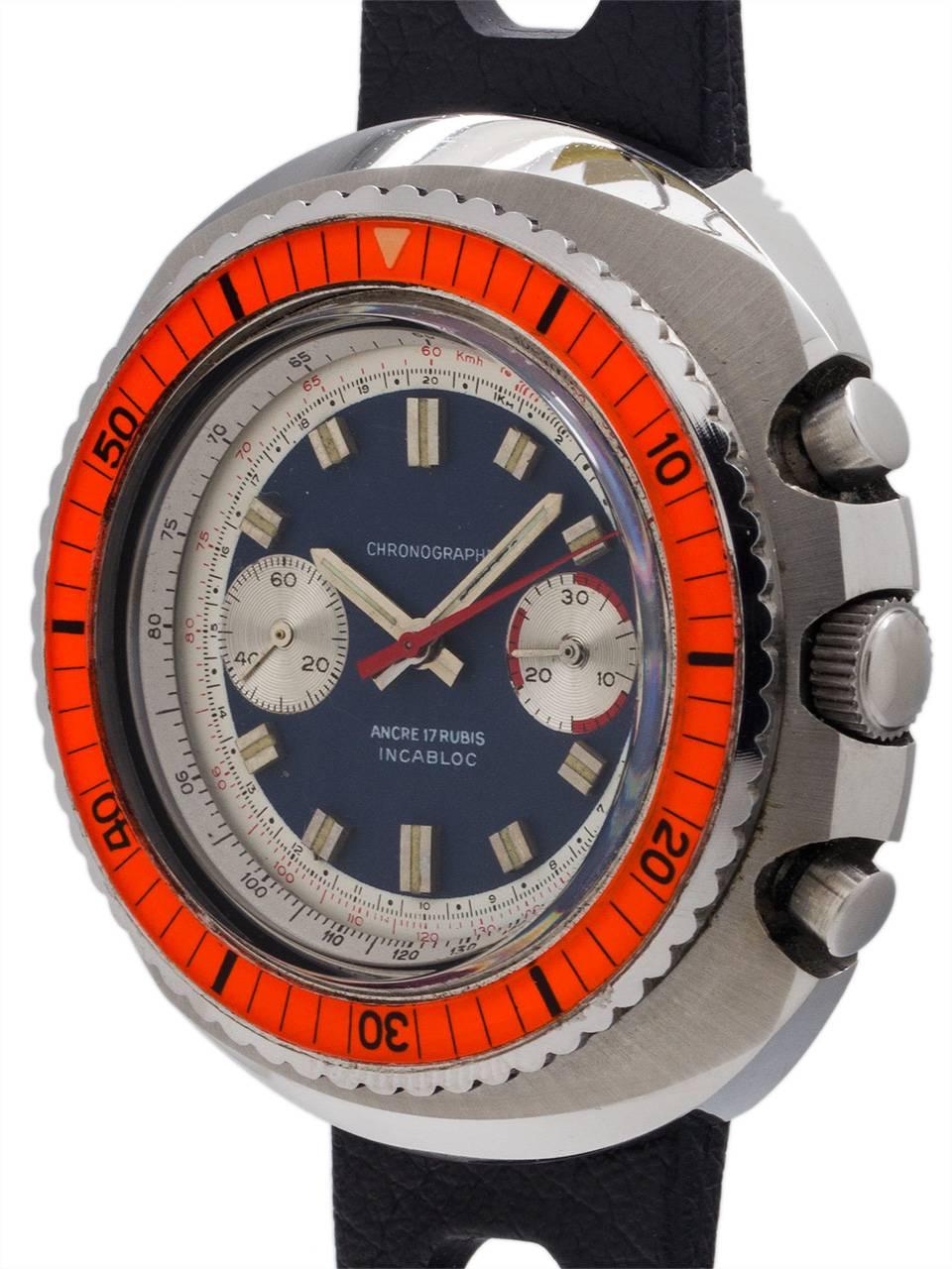 
Great looking oversize vintage Swiss 2 registers manual wind diver’s chronograph circa 1960’s. Featuring massive 47mm rounded cushion shaped brushed and polished finish case with protected crown and pushers, screw down caseback, and raised colorful
