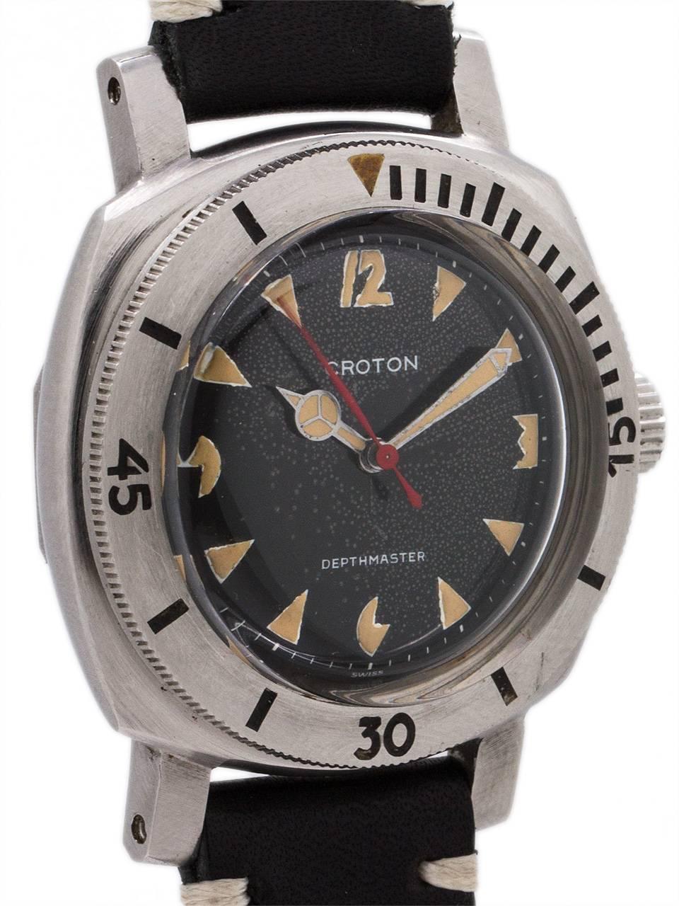 Croton Depthmaster 1000, stainless steel cushion shaped diver’s model with heavy and rugged lugs, wide, raised elapsed time bezel, and with dramatic glossy black original dial with patina’d art deco inspired luminous indexes and hands and red sweep
