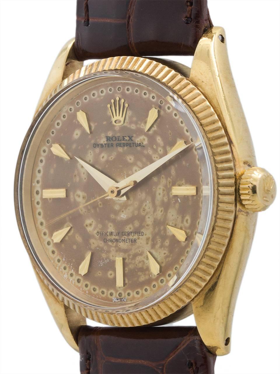 
Rolex 14K yellow gold Oyster Pereptual ref 6569 serial #158,xxx circa 1956. Featuring a 34mm diameter Oyster case with finely milled bezel, acrylic crystal and richly patina’d 2 piece dial with distinctive tapered and faceted applied gold indexes,