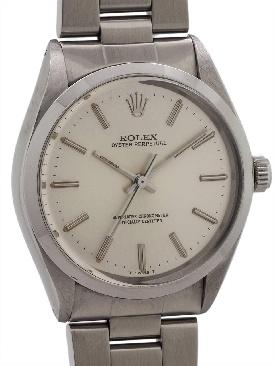 
Rolex Oyster Perpetual ref 1002, serial #8.8 million, circa 1985. Featuring 34mm diameter case with smooth bezel and acrylic crystal. Signed Rolex Oyster screw down crown and case back. Featuring very pleasing original silvered satin dial with