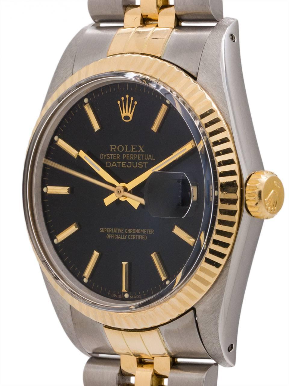 
An exceptionally well preserved example Rolex Datejust ref 16013 SS/18K YG circa 1986 with original black dial complete with box and papers. Featuring full size man’s 36mm diameter case with 18K YG fluted bezel, and acrylic crystal. Powered by