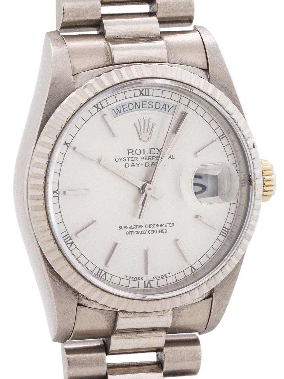 
Rolex 18K WG Day Date President ref# 18239, K serial # circa 1998. Featuring a 36mm diameter case with fluted bezel, sapphire crystal, and very pleasing original silvered satin dial with applied silver indexes and hands. Powered by calibre 3055