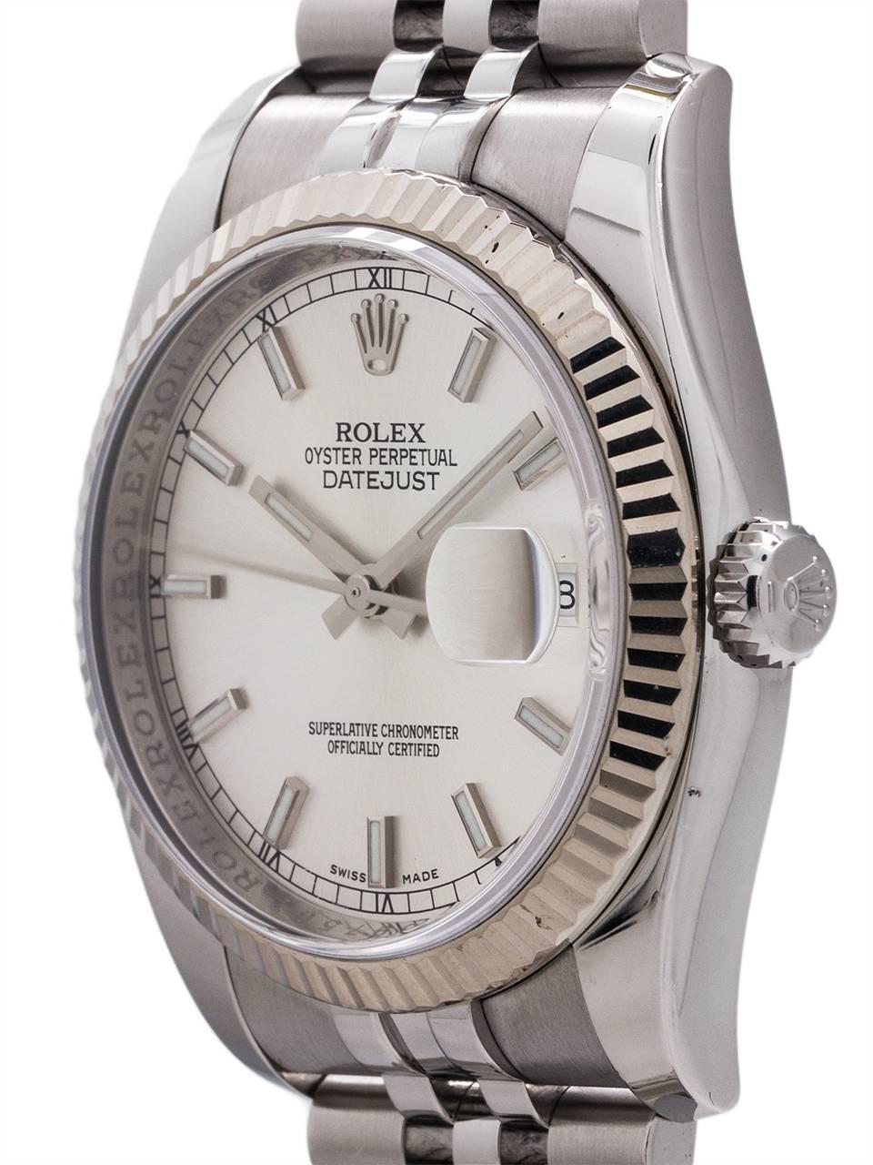 
Recent production Rolex Datejust ref # 116234, random serial # circa 2010+ in very minty preowned condition. Featuring classic 36mm diameter new style robust case with 18K WG fluted bezel, sapphire crystal, beautiful original silvered satin dial