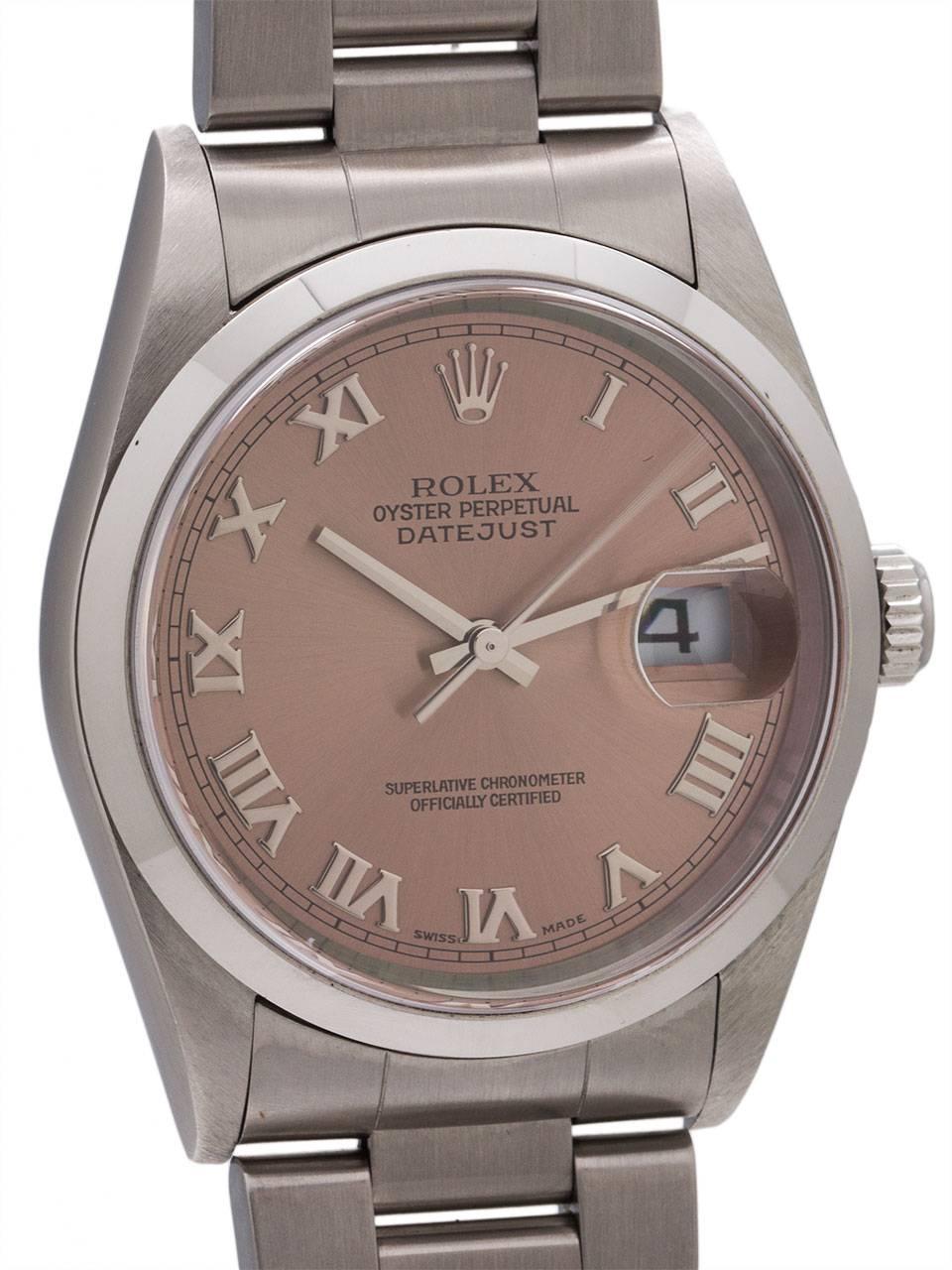 
Rolex SS Datejust ref #16200 full size 36mm diameter Oyster case with smooth bezel, sapphire crystal, and antique salmon dial with heavy Roman silver figures, A8 serial # circa 1999. Self winding calibre 3135 quickset movement with date and sweep