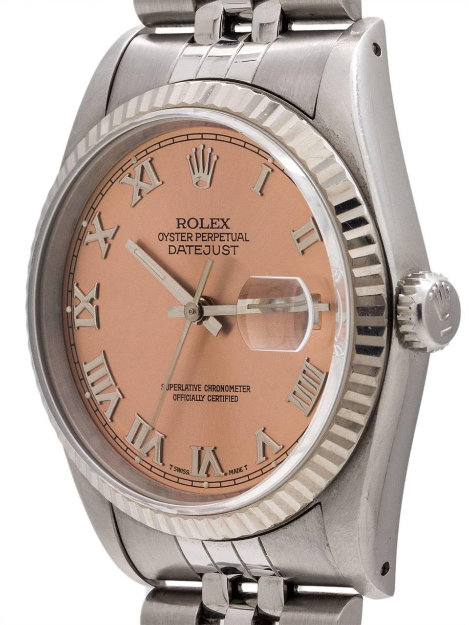 
Rolex Stainless Steel Datejust ref 16234 serial #E3 circa 1990. Featuring 36mm diameter Oyster case with 18K WG fluted bezel and sapphire crystal. With popular original Rose Roman dial. Powered by self winding calibre 3135 movement with quick set